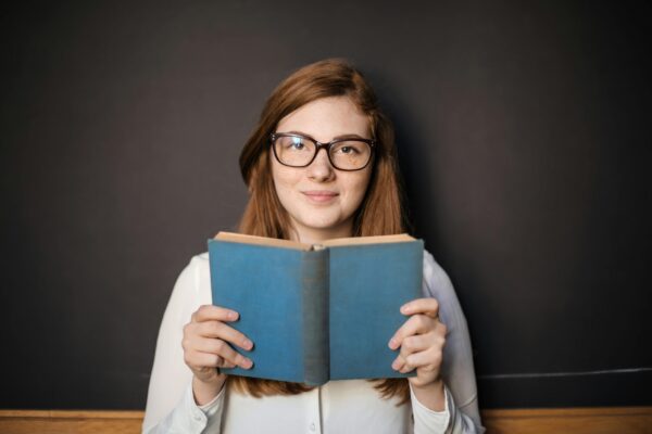 Girl reading book & gaining knowledge of essential tools to conquer anxiety